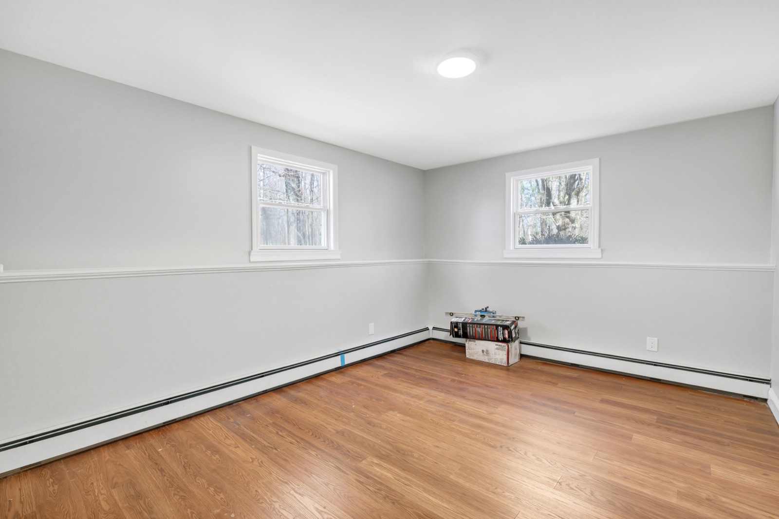 Empty New Milford CT first-floor bedroom before virtual staging as home office