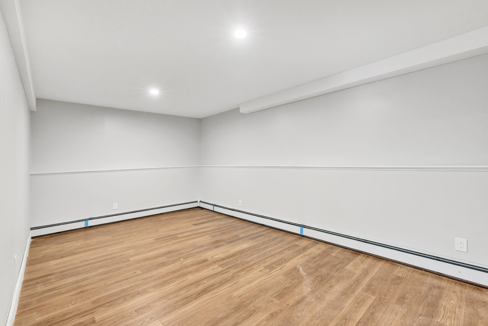 Empty New Milford CT ground-floor media room before virtual staging