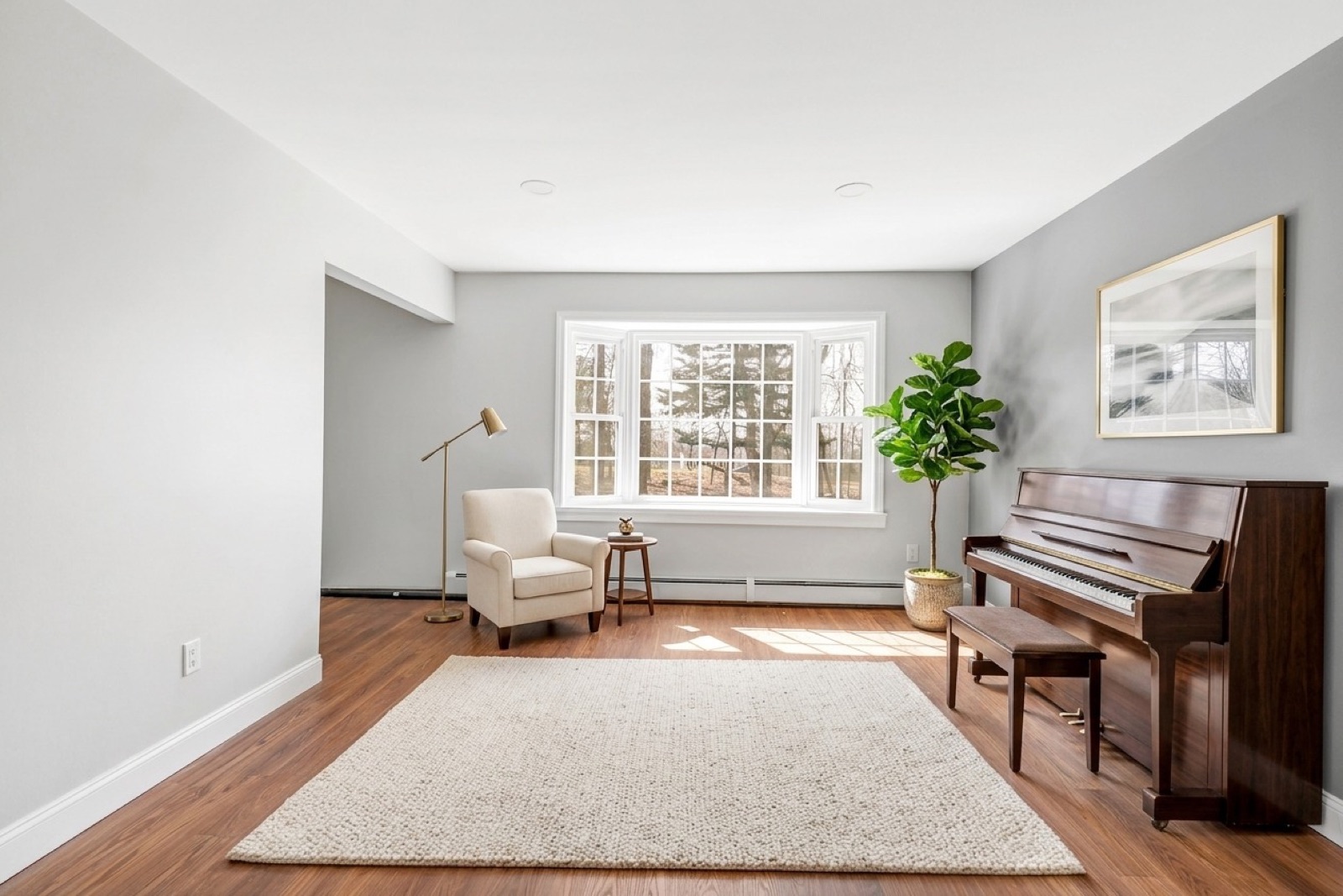 New Milford CT music room after virtual staging with piano and accent chairs