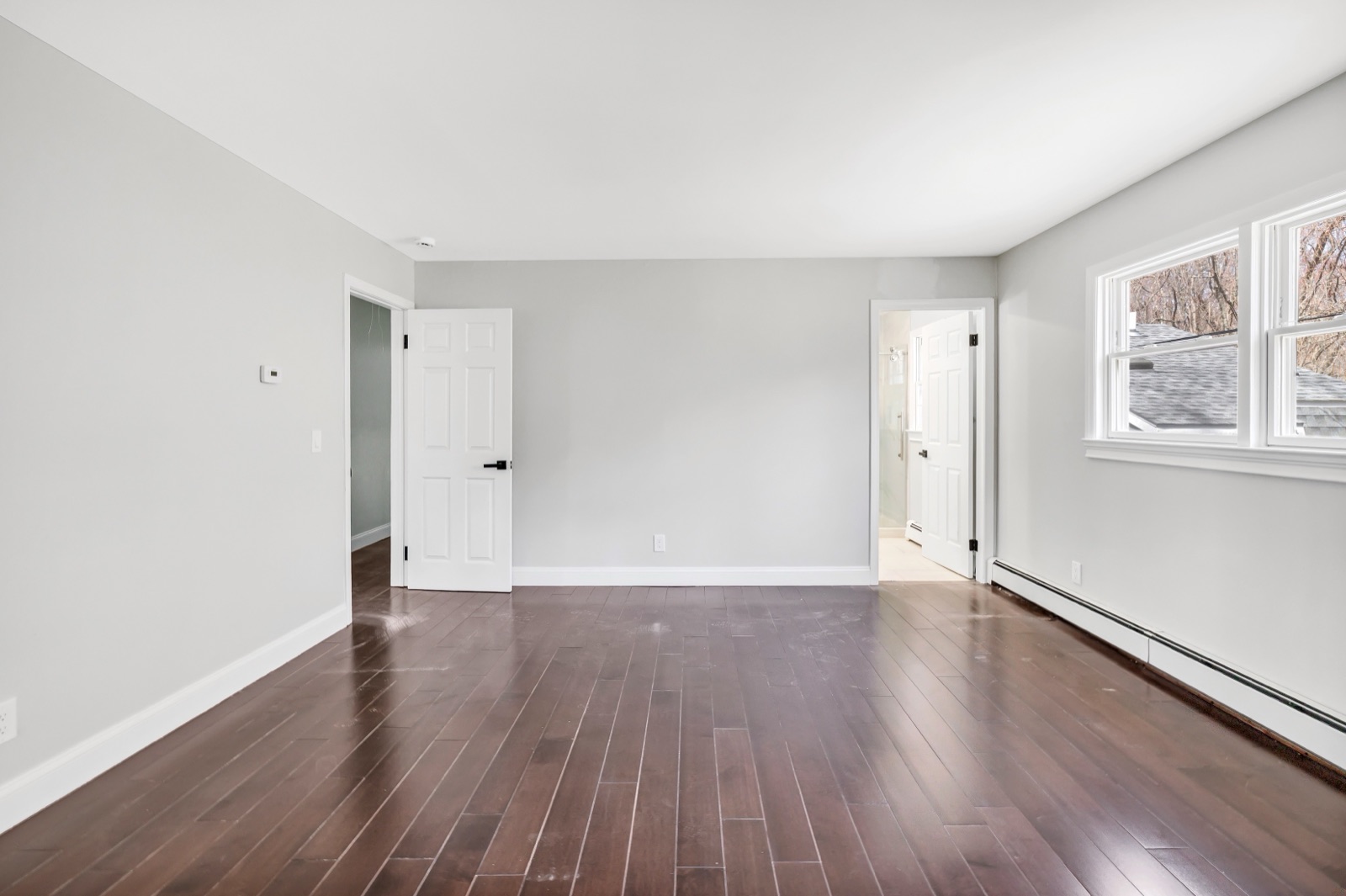 Empty New Milford CT top-floor primary suite before virtual staging
