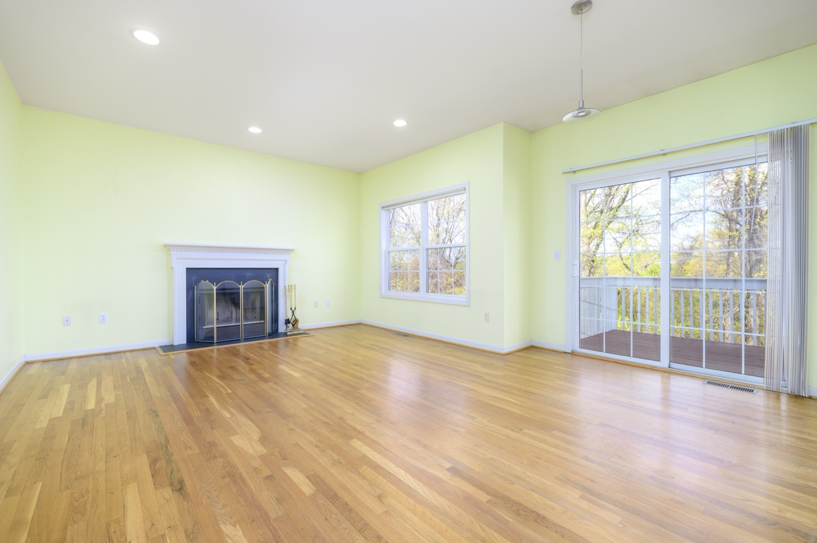 Empty Norwalk CT family room with fireplace before virtual staging