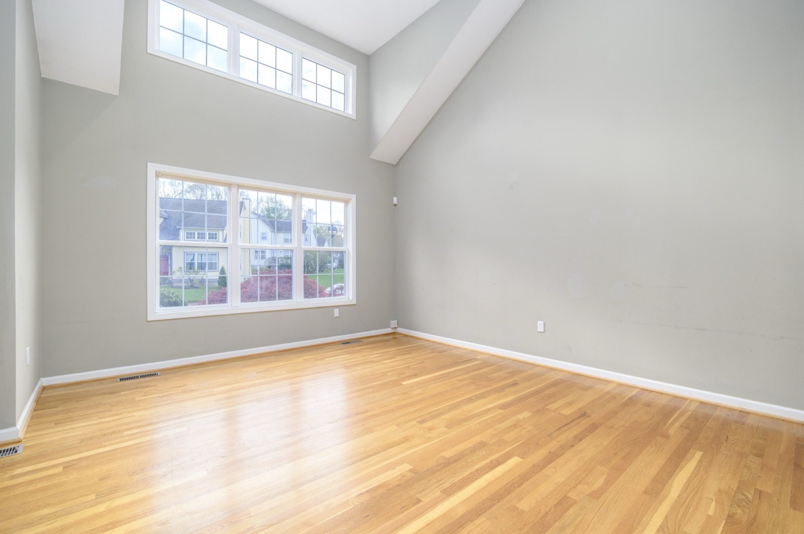 Empty Norwalk CT two-story living room before virtual staging