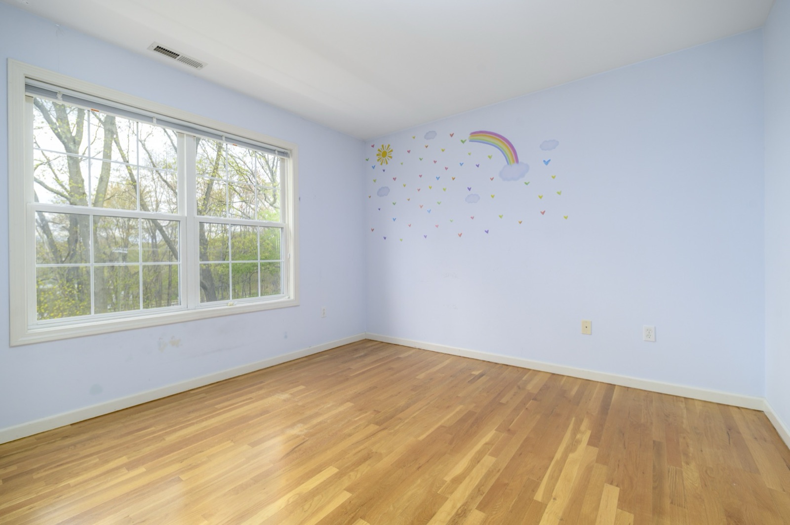 Empty Norwalk CT nursery with accent wall before virtual staging