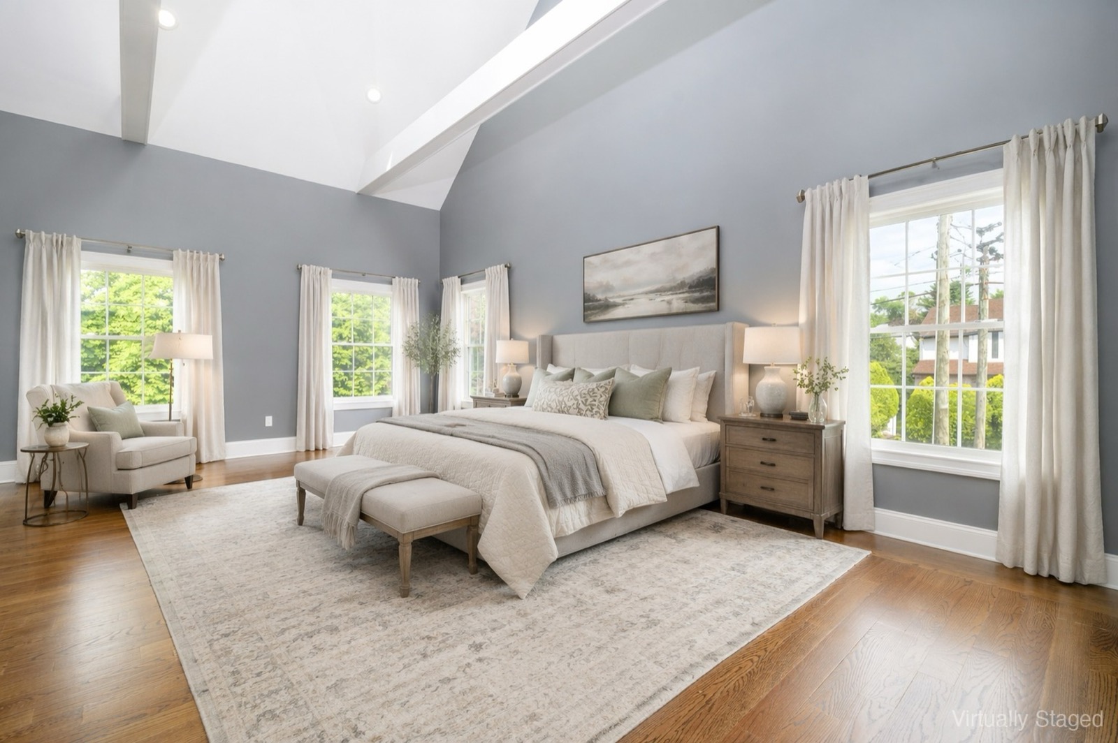 Stamford CT primary bedroom after virtual staging with king bed and vaulted ceiling